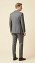 Man wearing the F.Ferrante FEU230 tailored two-button suit in grey, styled with a white shirt, charcoal tie and dark brown Oxford shoes