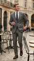Man wearing the F.Ferrante FEU230 tailored two-button suit in grey, styled with a white shirt, charcoal tie and dark brown Oxford shoes